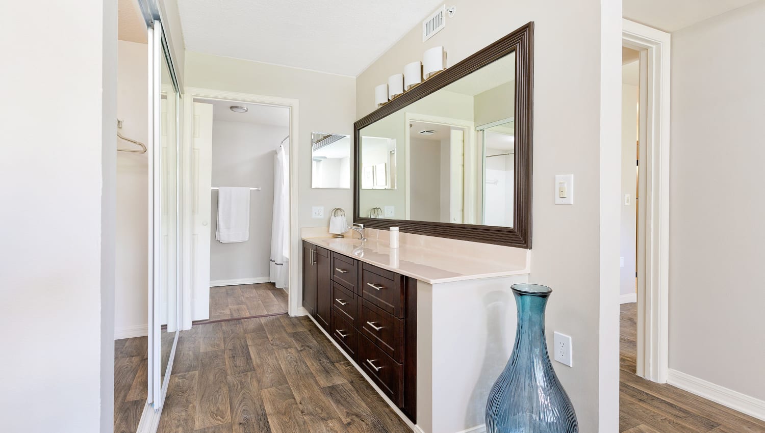 Large primary bathroom at Sanctuary Cove Apartments in West Palm Beach, Florida