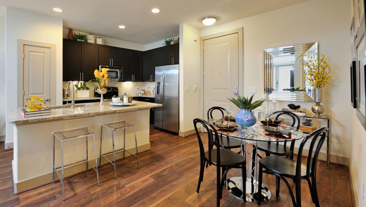 Dining table and kitchen area at Olympus Falcon Landing in Katy, Texas