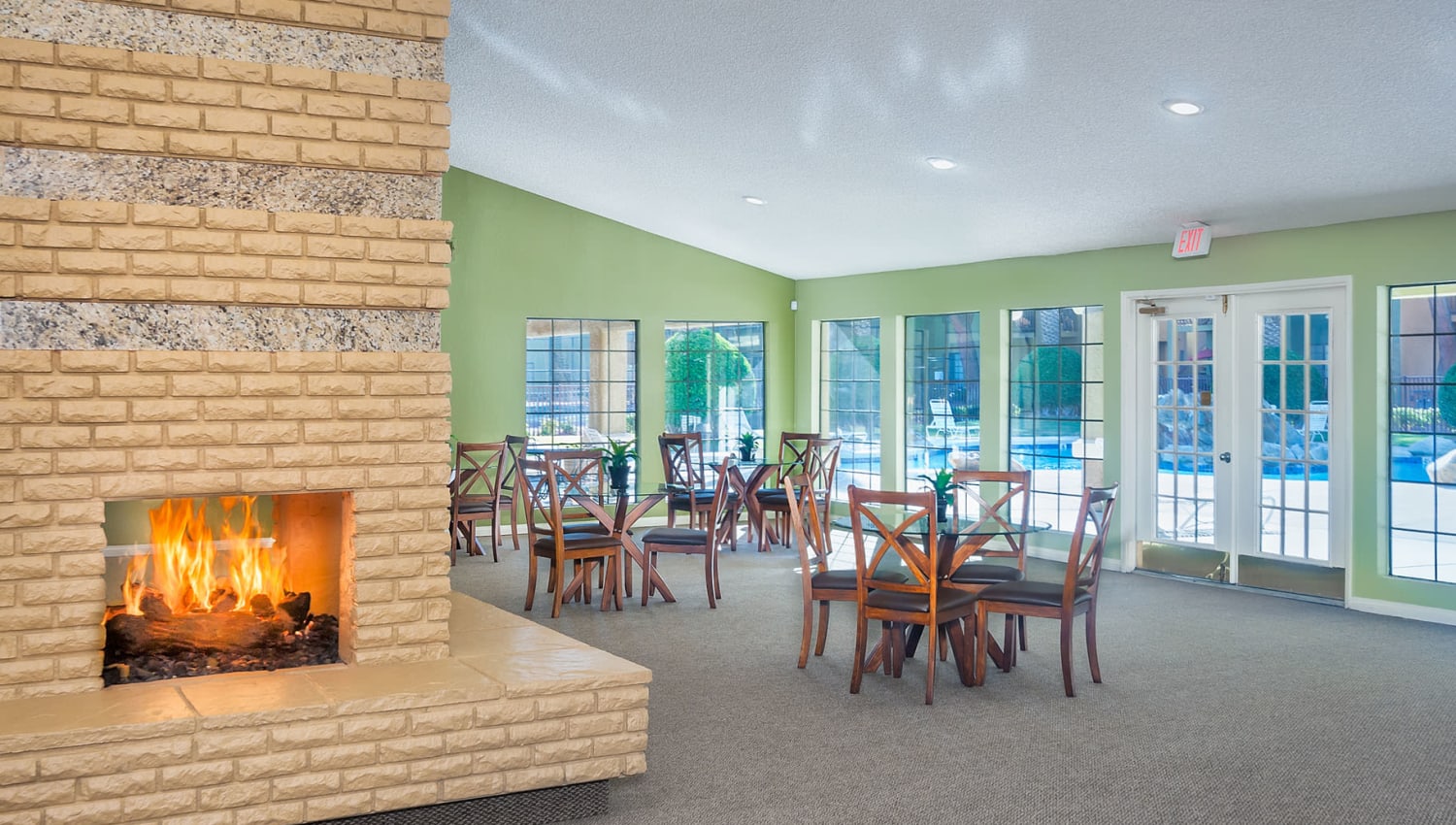 Fireplace and seating areas in the clubhouse at Shelter Cove Apartments in Las Vegas, Nevada