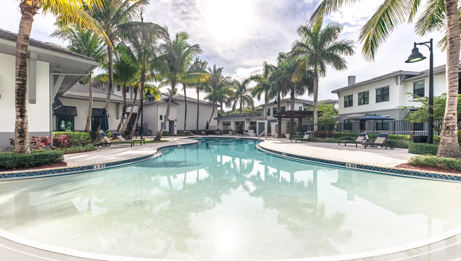Sparkling pool at The Hamptons at Palm Beach Gardens Apartments in Palm Beach Gardens, Florida