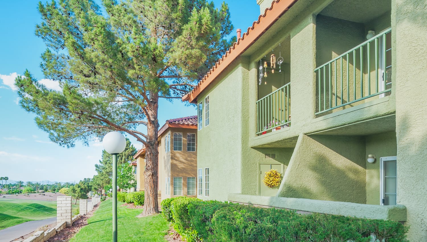 Exterior apartment views and golf course at Invitational Apartments in Henderson, Nevada