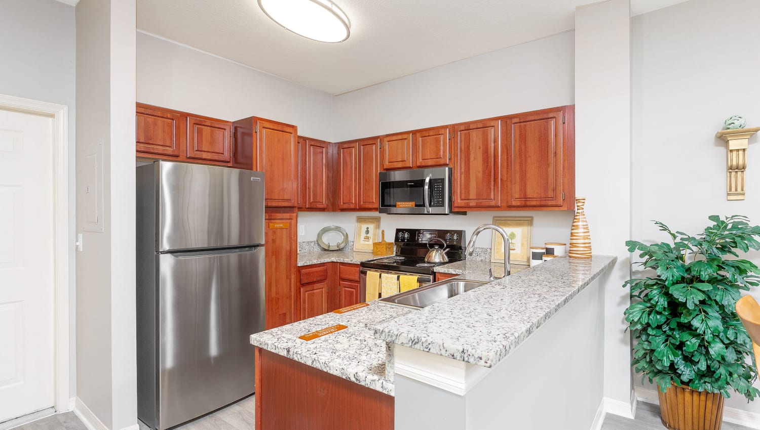 Model kitchen in apartment at Villas of Juno Apartments in Juno Beach, Florida