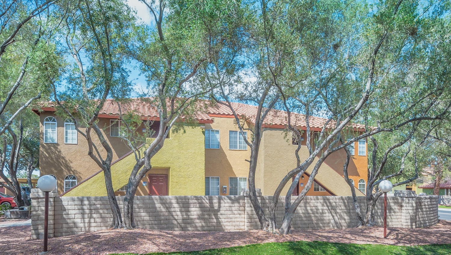 Exterior view and foliage at Hidden Cove Apartments in Las Vegas, Nevada