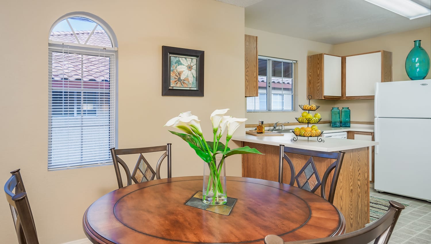 Dining area and kitchen in apartment at Hidden Cove Apartments in Las Vegas, Nevada