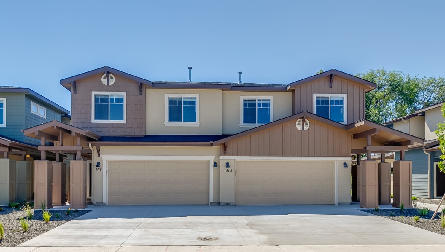 Exterior of a high-end two-story townhome at Olympus at Ten Mile in Meridian, Idaho