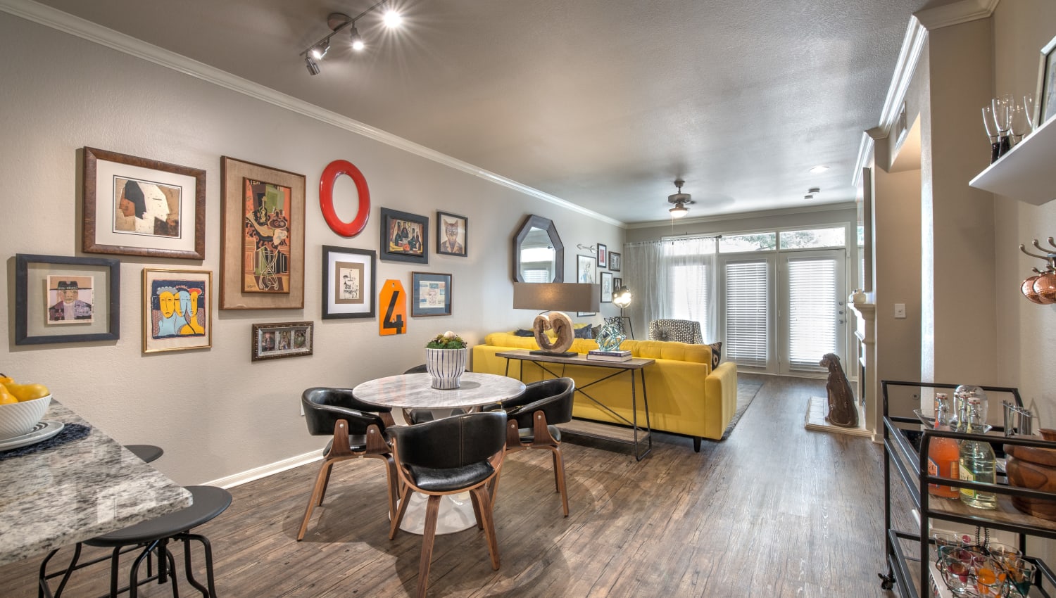 Dining area and living space in a spacious open floorplan home at 75 West in Dallas, Texas