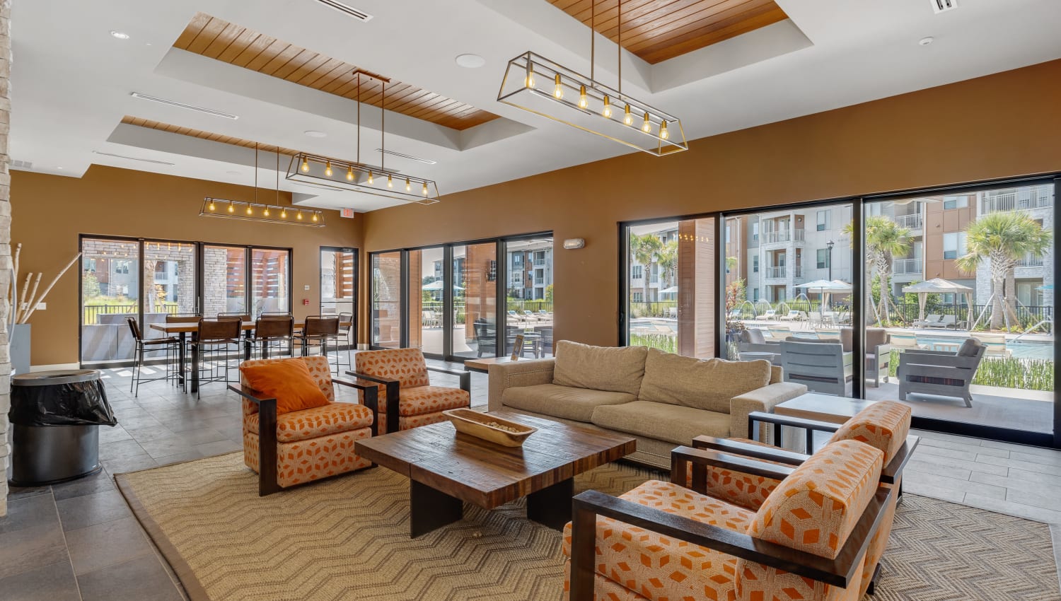 Comfortable couch and chairs in the resident clubhouse at The Point at Town Center in Jacksonville, Florida