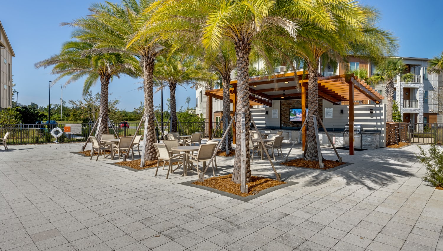 Poolside pavilion with grilling stations at The Point at Town Center in Jacksonville, Florida