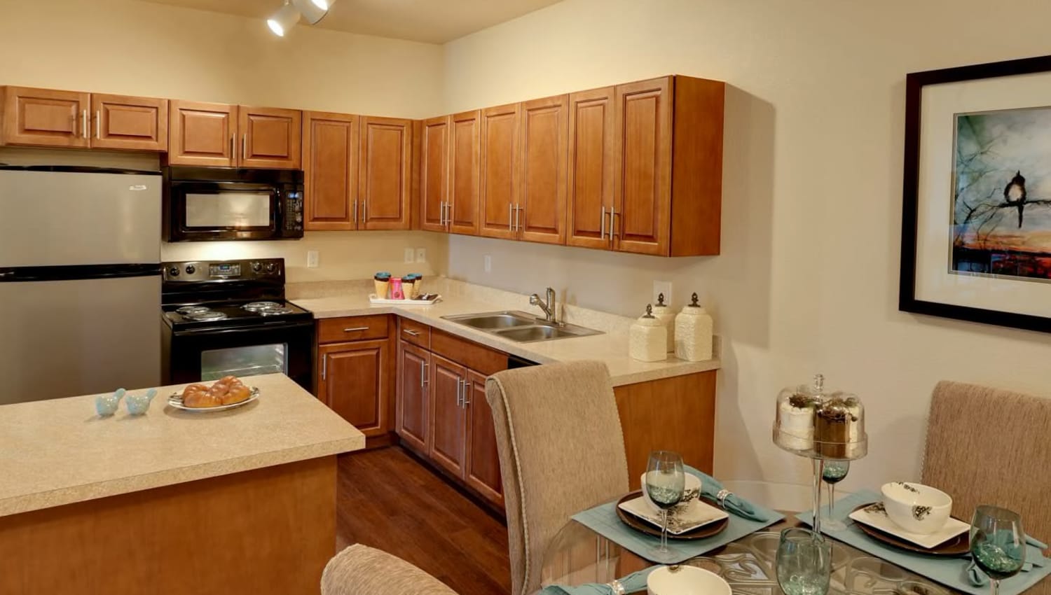 Model kitchen and dining table at The Preserve at Greenway Park in Casper, Wyoming