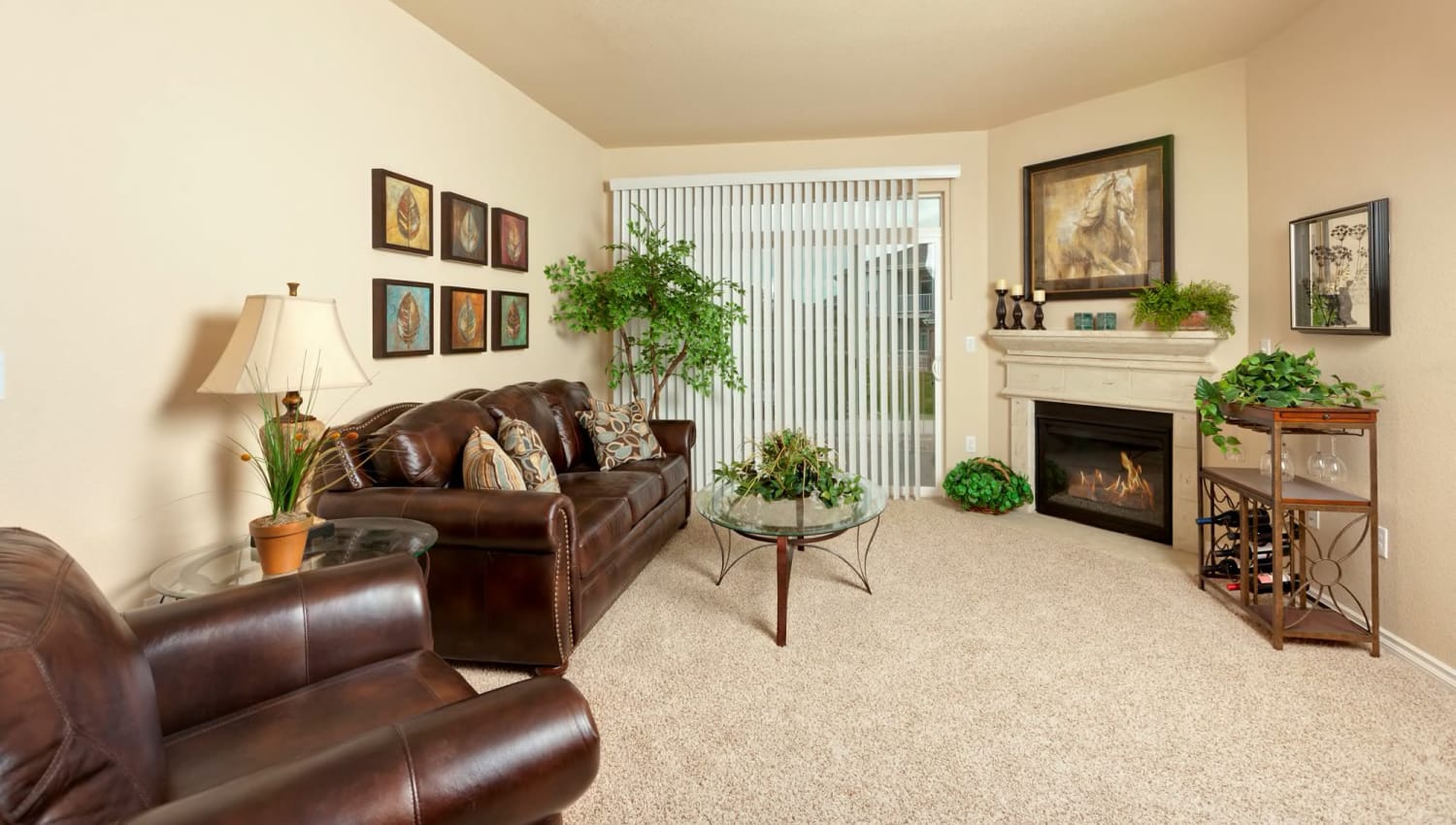 Model living room with fireplace at The Preserve at Greenway Park in Casper, Wyoming