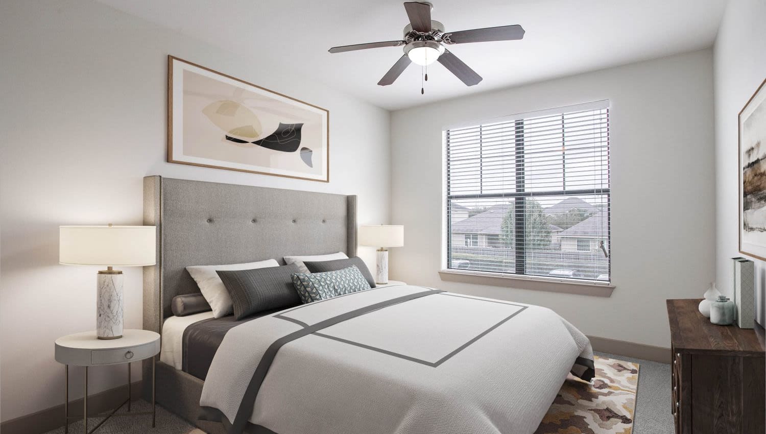 Model bedroom with ceiling fan at Olympus Falcon Landing in Katy, Texas