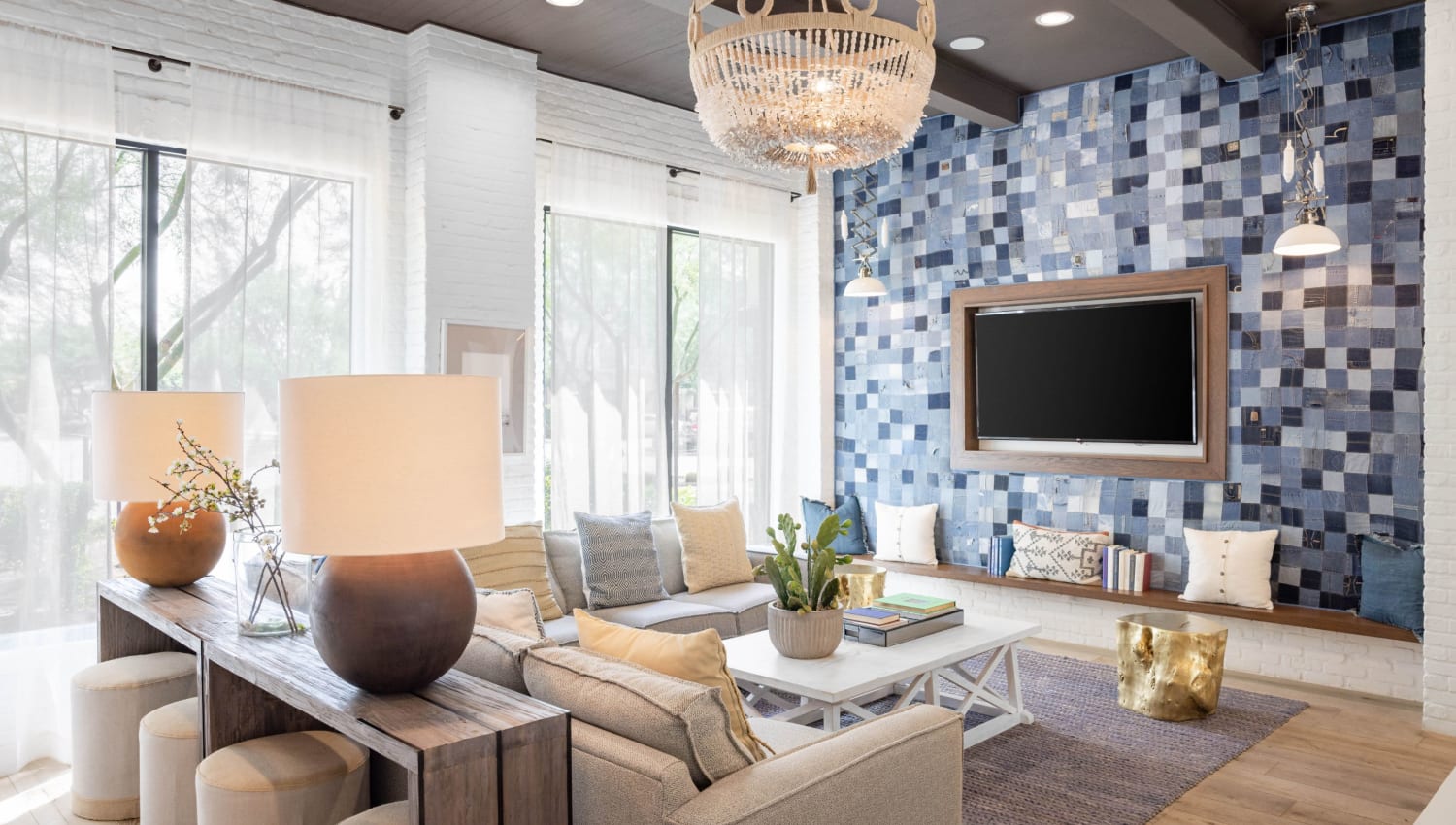 Clubhouse couches with TV and modern decor at Cadia Crossing in Gilbert, Arizona