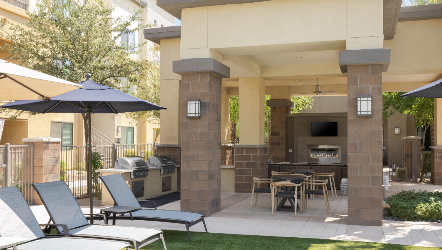 Barbecue and lounge chairs poolside at Cadia Crossing in Gilbert, Arizona