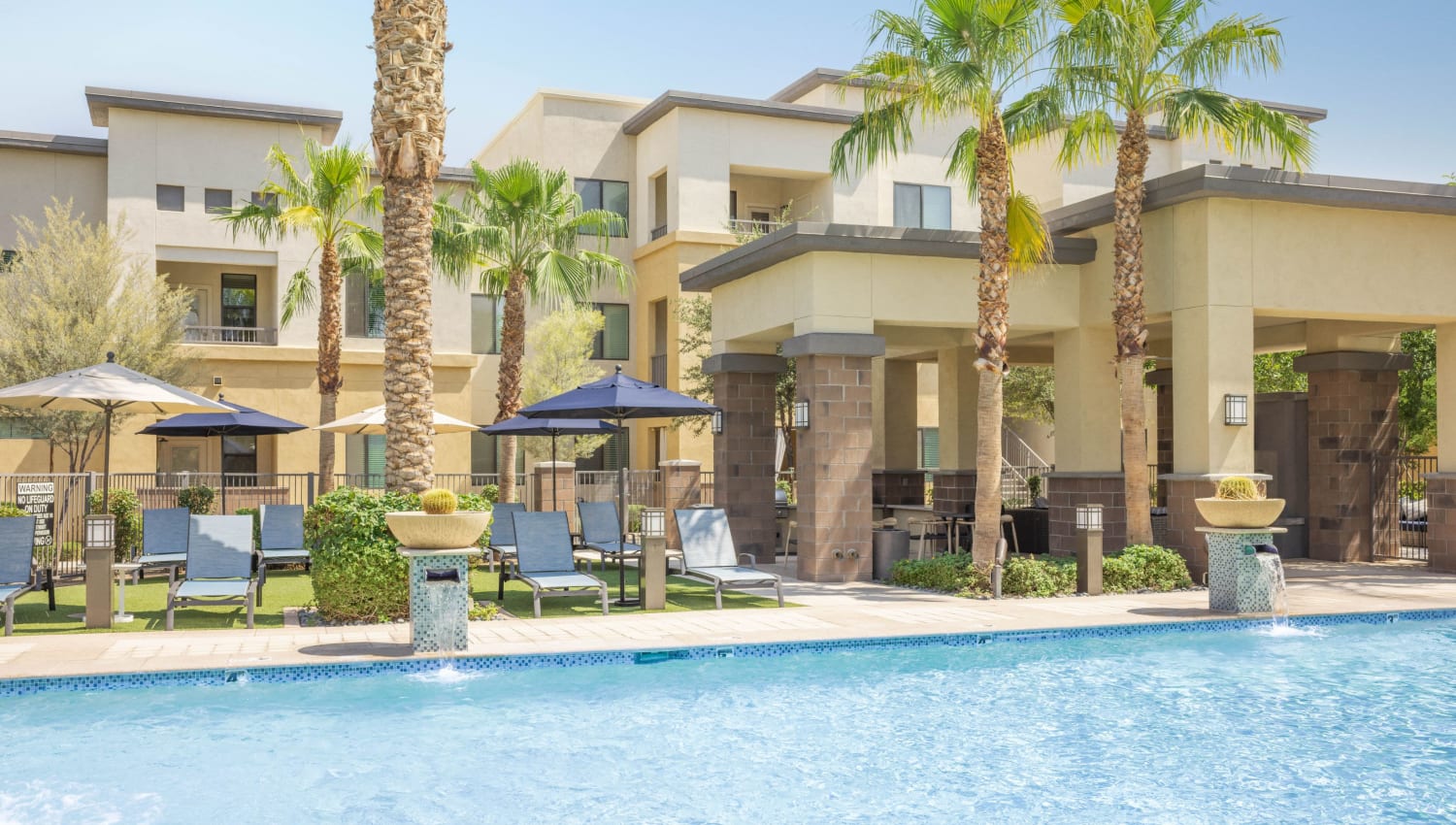 Outdoor pool with shaded seating at Cadia Crossing in Gilbert, Arizona