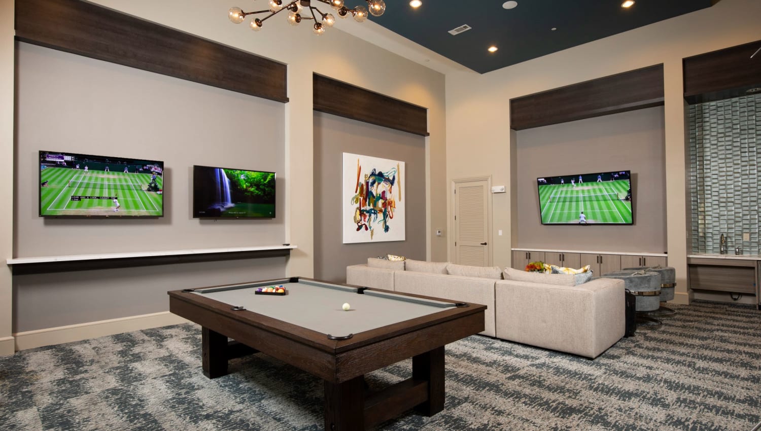 Pool table and plenty of TVs in the Clubhouse at Olympus at Memorial in Houston, Texas