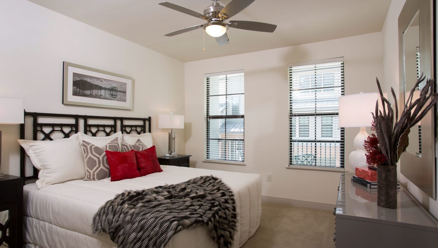 Well decorated model bedroom with plenty of natural light at Olympus at Memorial in Houston, Texas
