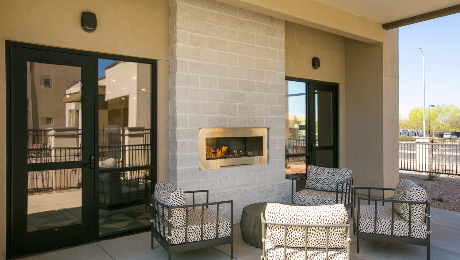 Clubhouse patio with outdoor fireplace at Olympus de Santa Fe, Santa Fe, New Mexico