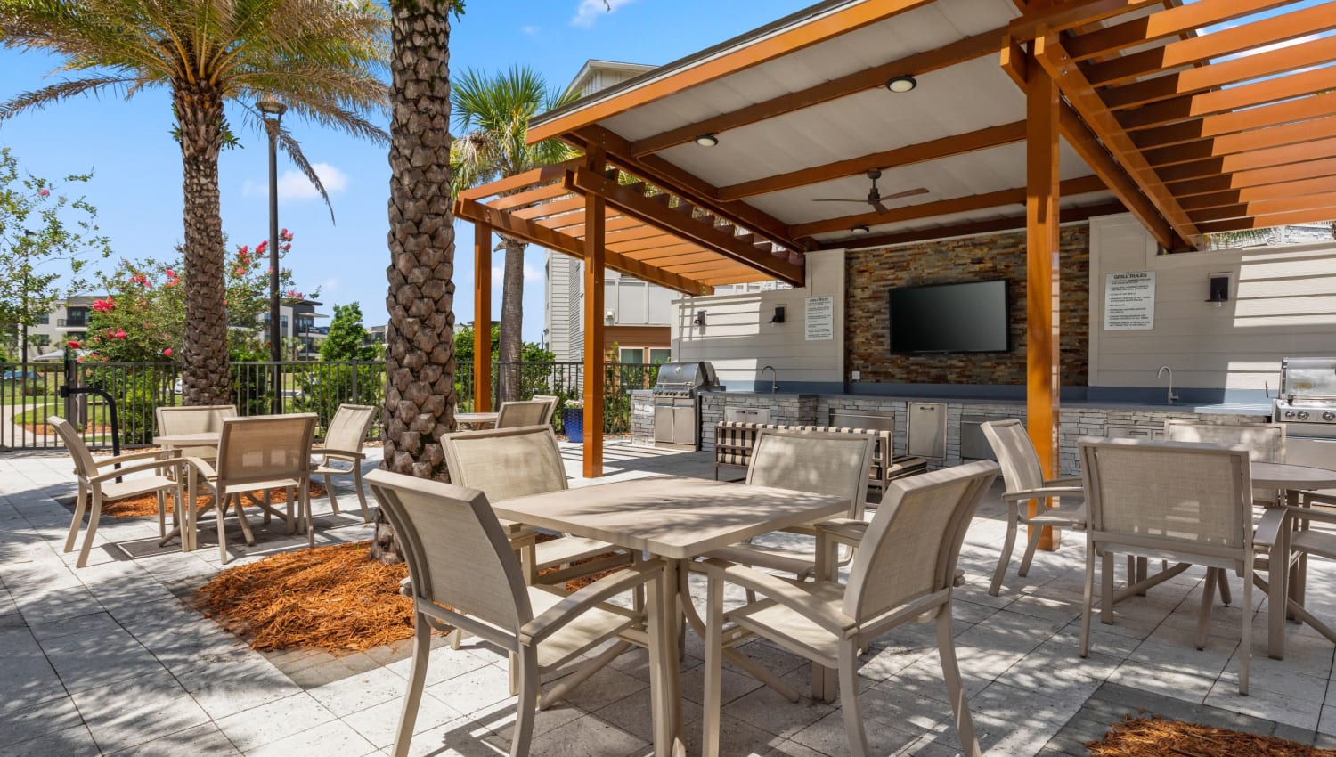 Outdoor patio with tables and bar seating at The Point at Town Center in Jacksonville, Florida