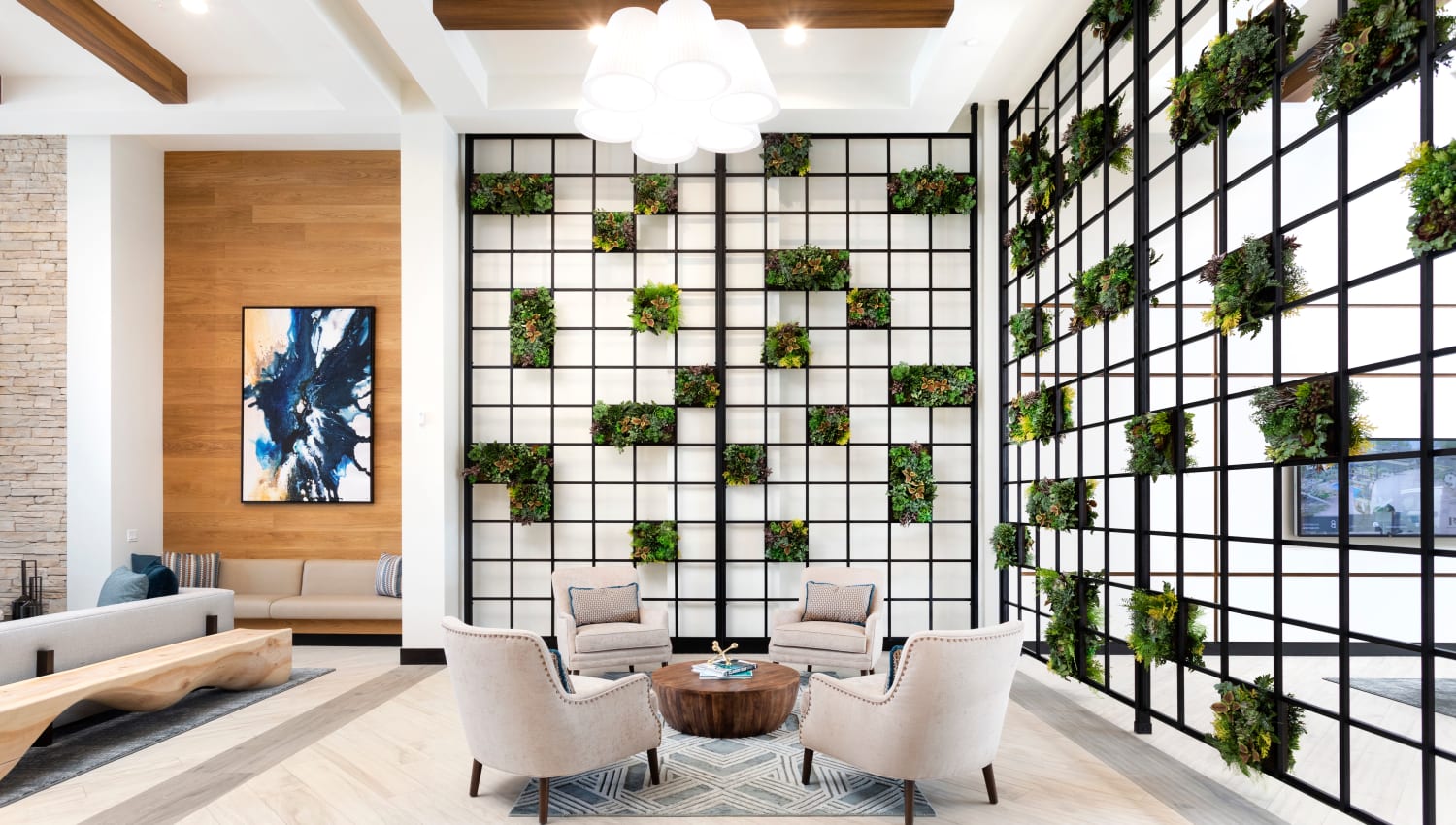 Clubhouse seating area with lively plants at The Residences at Escaya in Chula Vista, California
