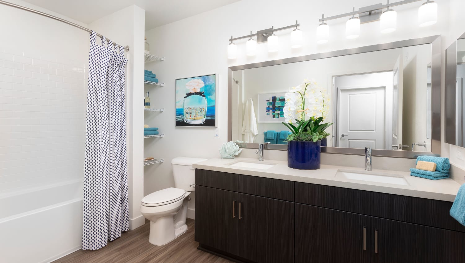 Model bathroom with blue accents at The Residences at Escaya in Chula Vista, California