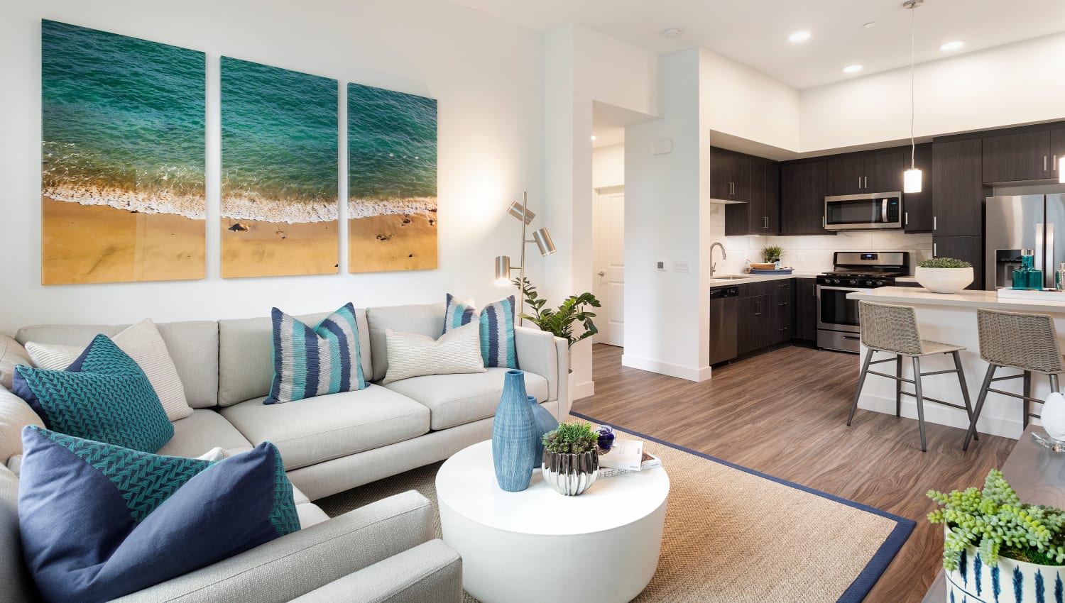 Model living space with ocean-style decoration at The Residences at Escaya in Chula Vista, California