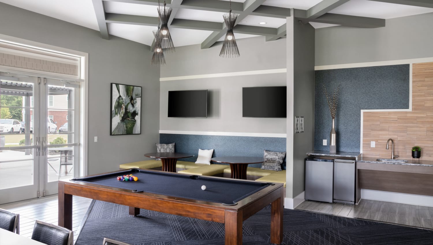 Pool table and TVs in clubhouse at The Palmer in Charlotte, North Carolina