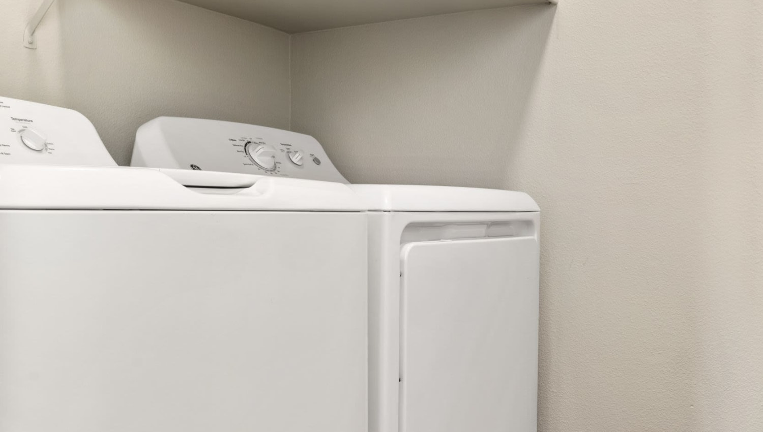 In unit washer and dryer at Olympus Las Colinas in Irving, Texas