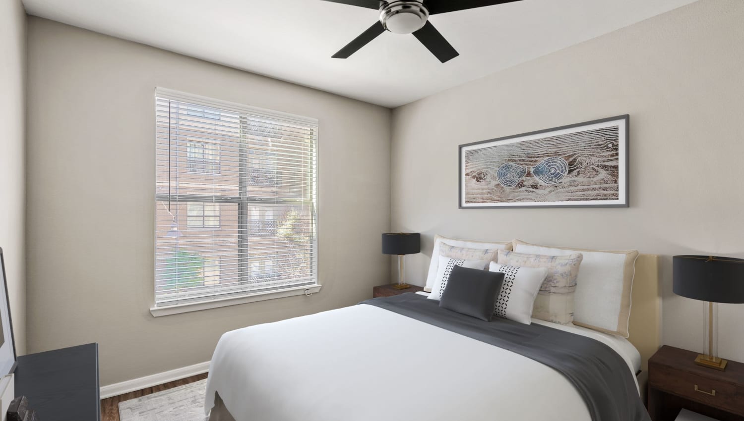 Well decorated model bedroom with ceiling fan at Olympus Boulevard in Frisco, Texas