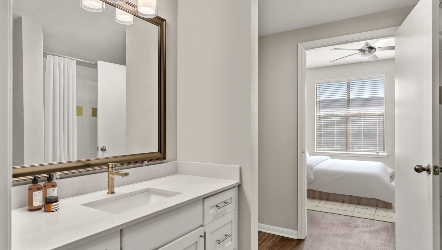 Bathroom across the hall from a model bedroom at Olympus Boulevard in Frisco, Texas
