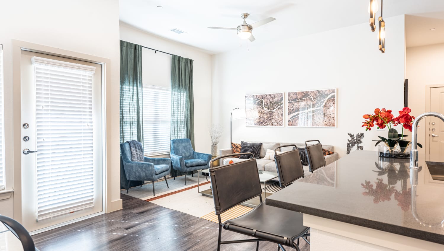 Living space with blue accents at The Everett at Ally Village in Midland, Texas
