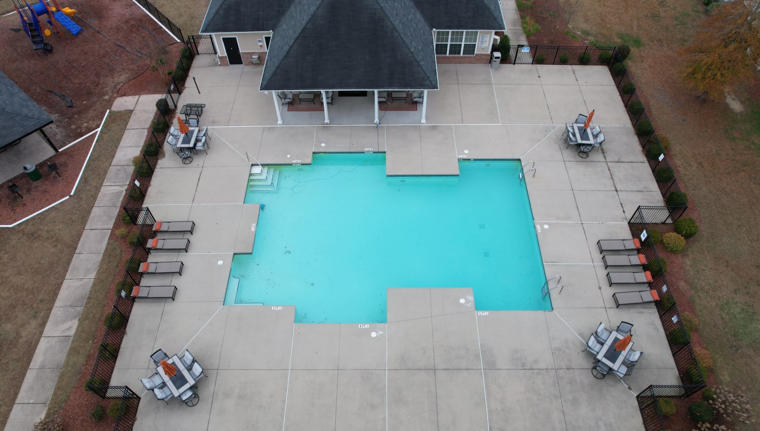 Swimming pool with poolside seating at Olympus at Jack Britt in Fayetteville, North Carolina