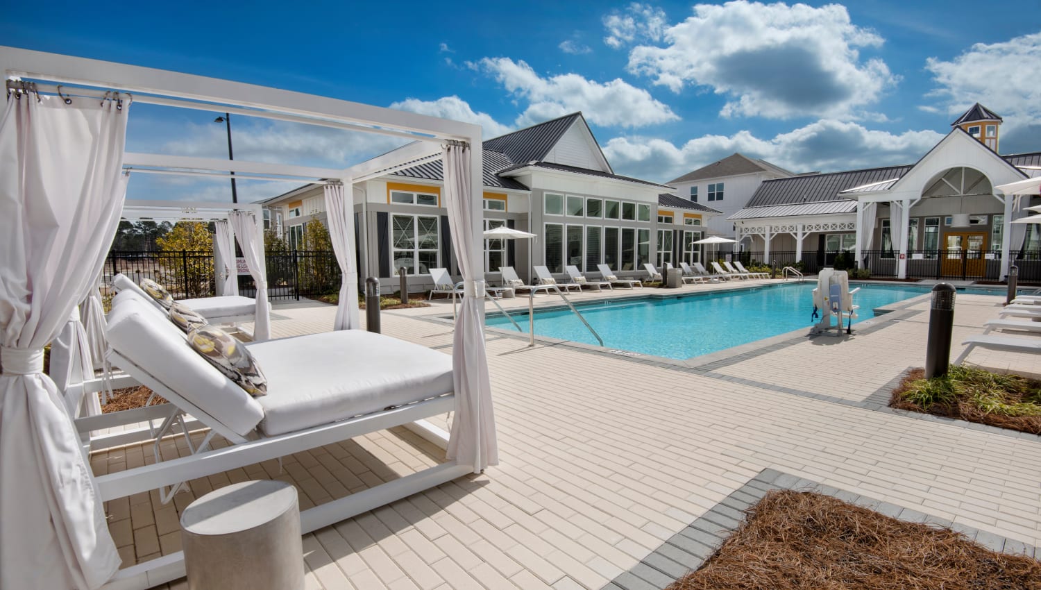Poolside cabanas and lounge chairs at Capital Crest at Godley Station in Savannah, Georgia