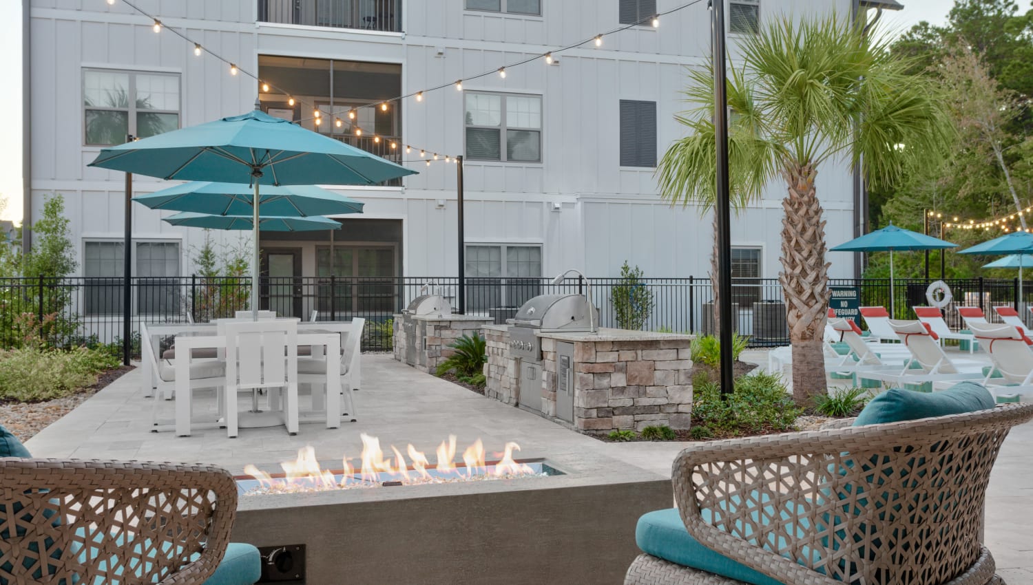 Outdoor seating and fire table at Alleia Luxury Apartments in Savannah, Georgia