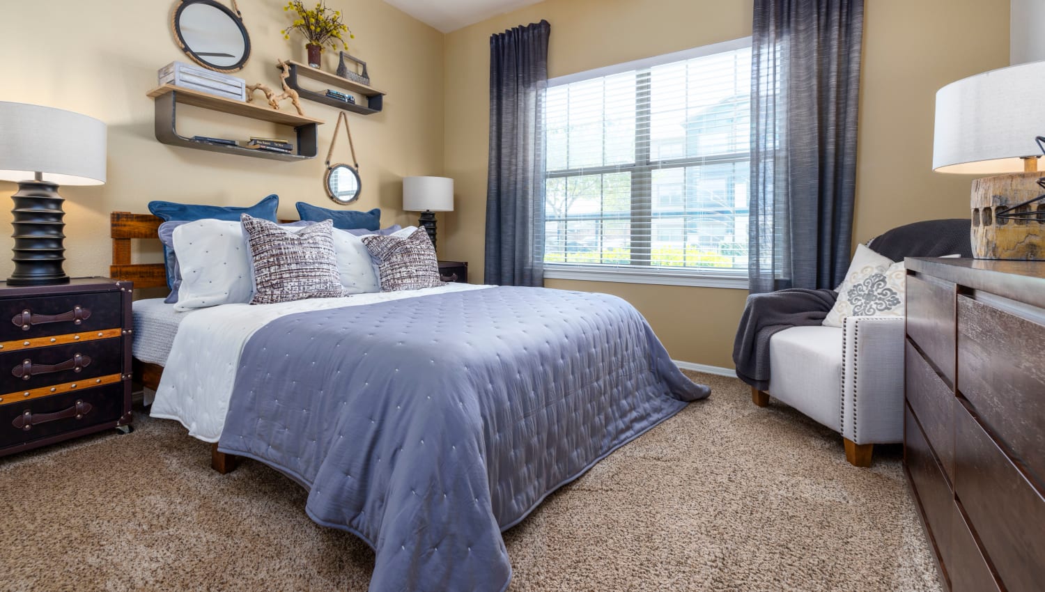 Fully carpeted bedroom at Carrington Oaks in Buda, Texas