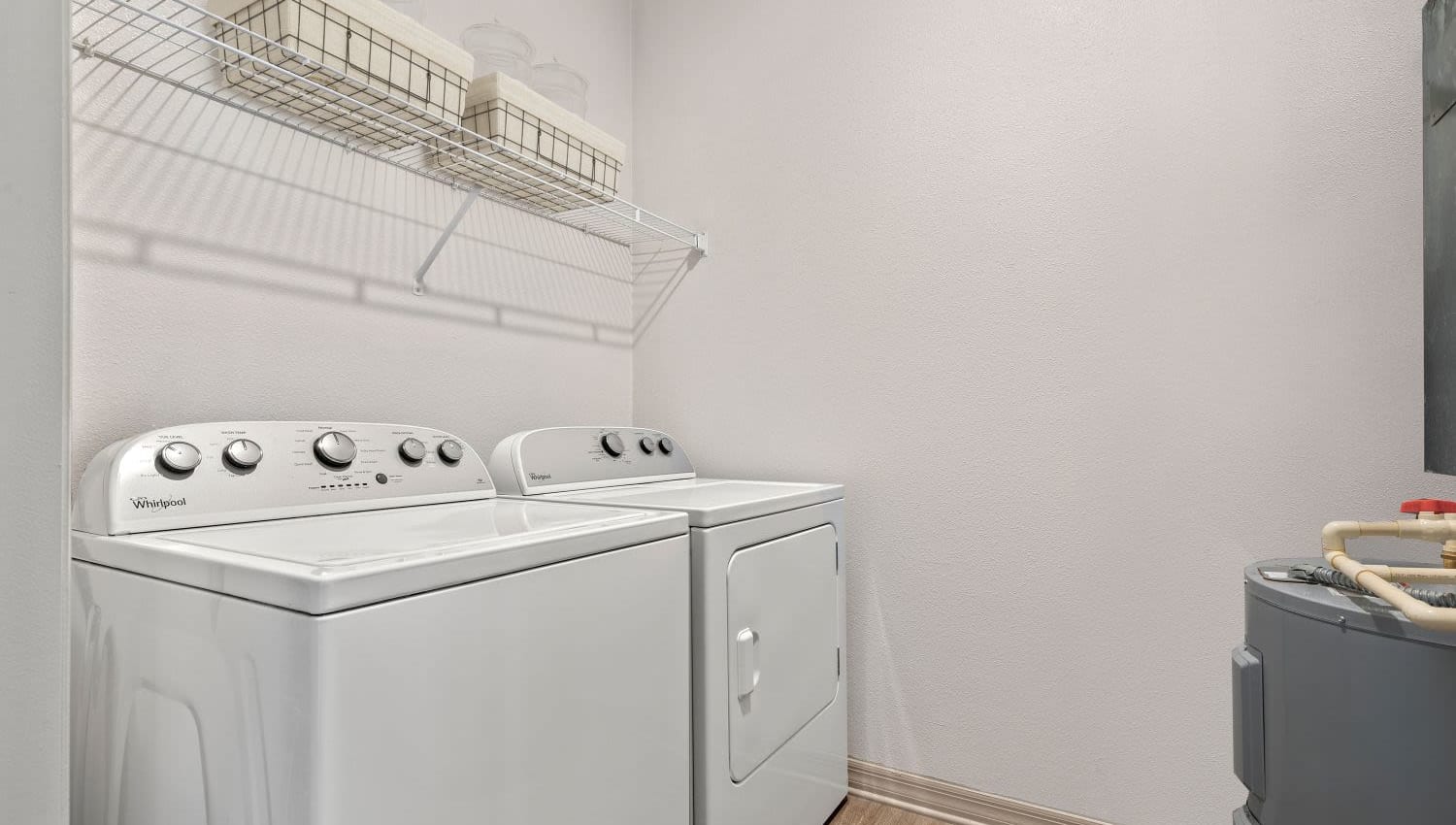 Laundry area with washing machine and dryer at Lakeline at Bartram Park in Jacksonville, Florida