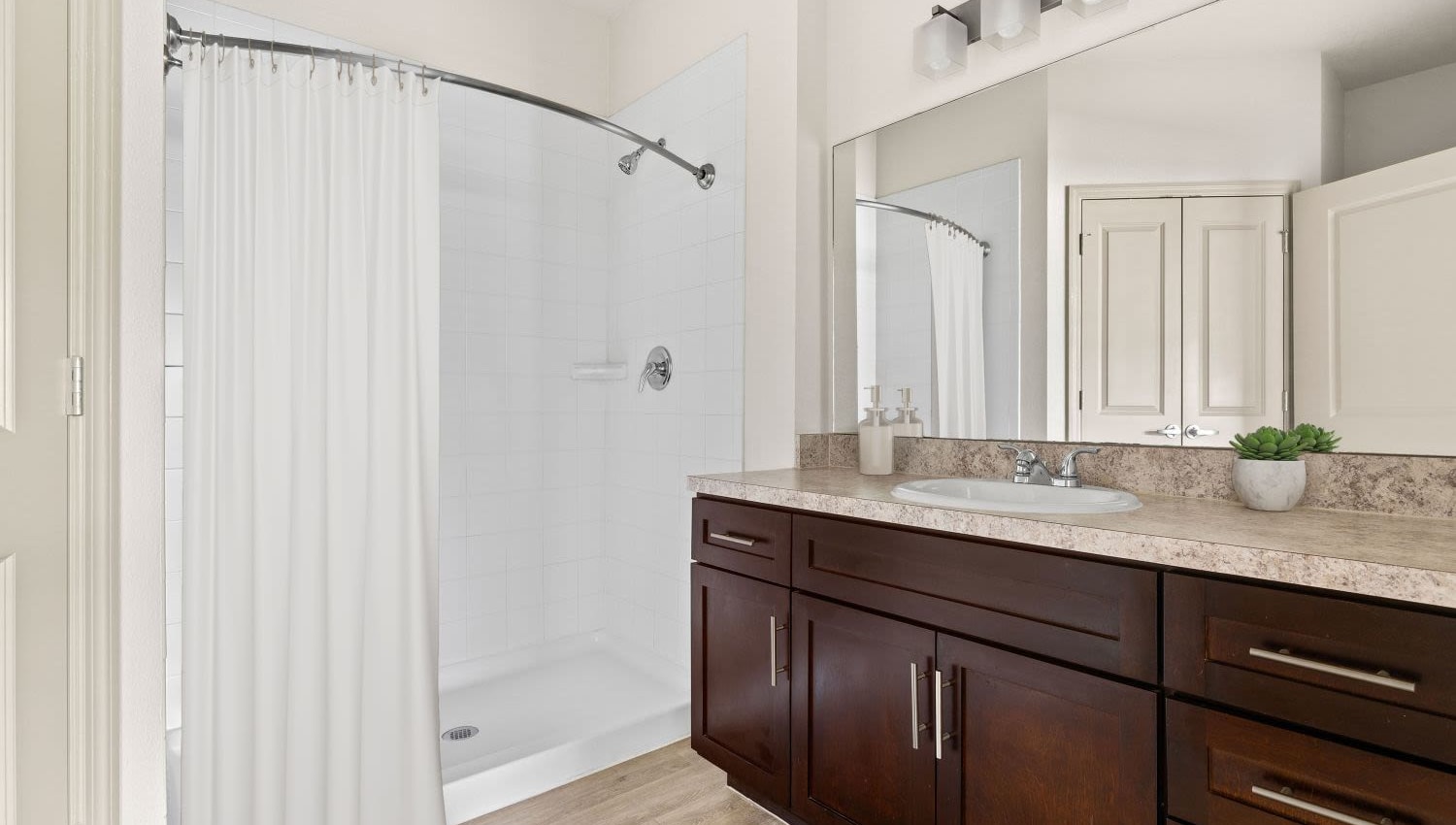 Personal bathroom and sink with bath tub at Lakeline at Bartram Park in Jacksonville, Florida