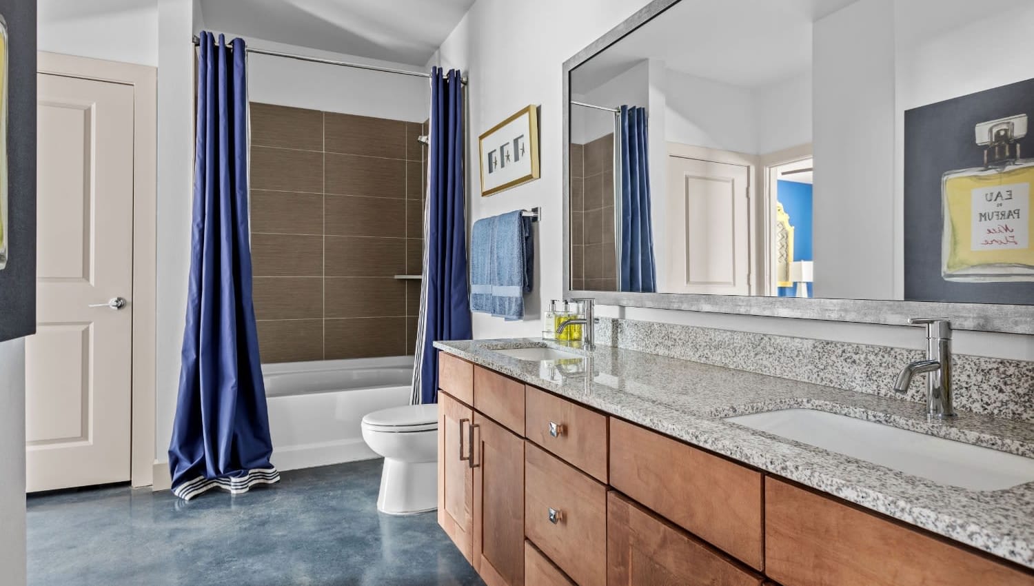 Large bathroom with a bathtub at The Davis in Fort Worth, Texas