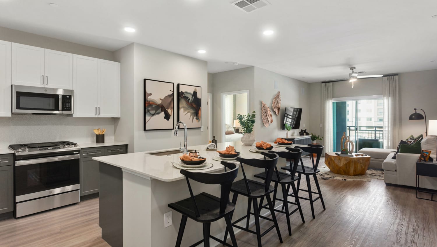 Beautiful kitchen with island seating at Olympus Chandler at the Park in Chandler, Arizona