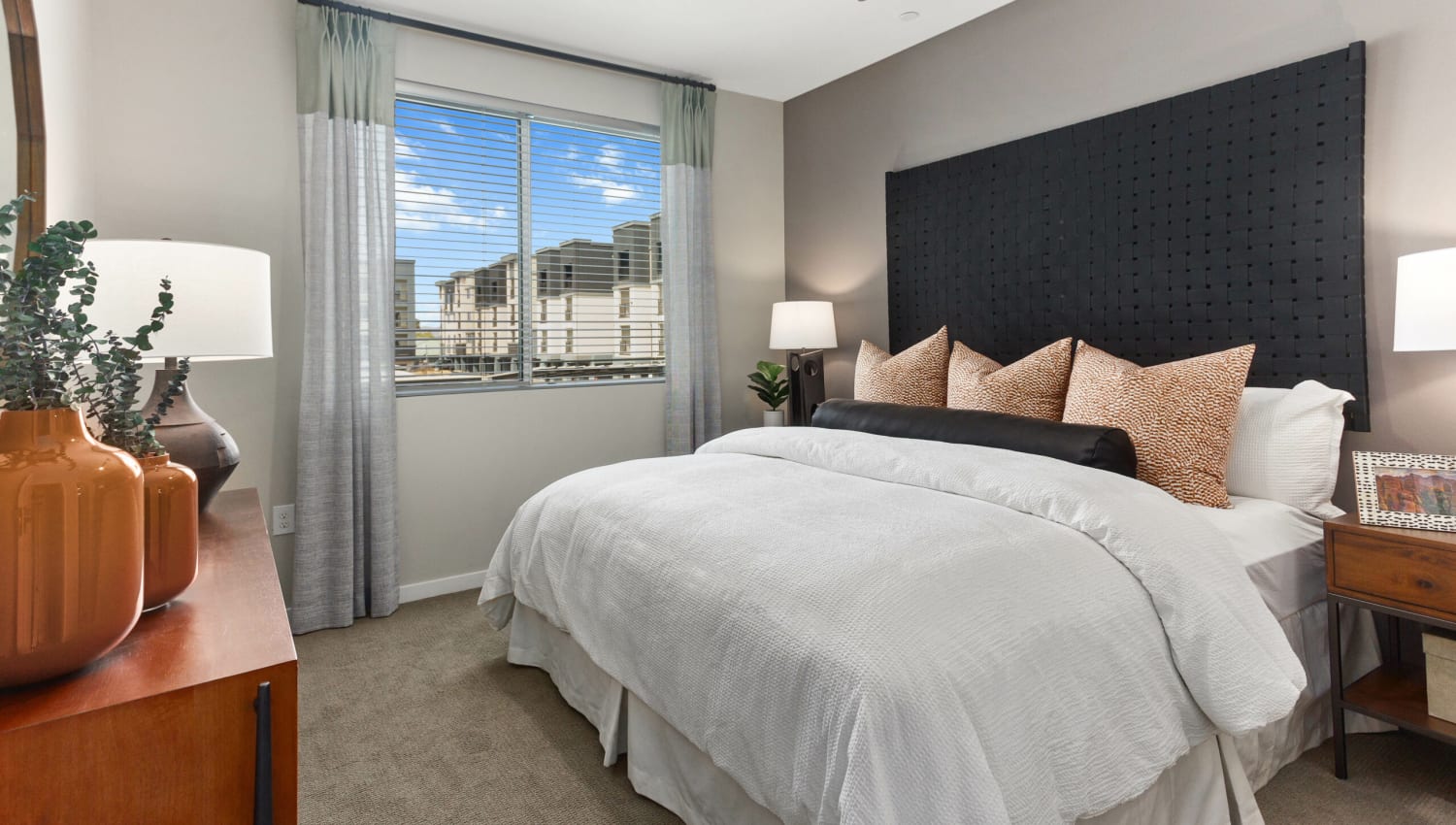 Bedroom with large window at Olympus Chandler at the Park in Chandler, Arizona
