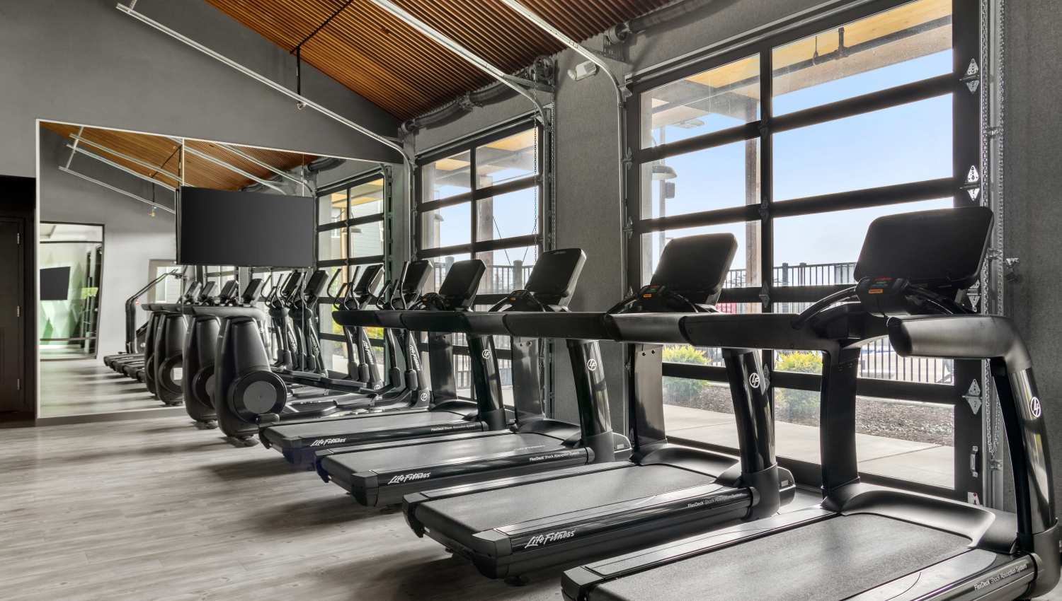 Treadmills and fitness machines in the gym at 207 East in Edgewood, Washington