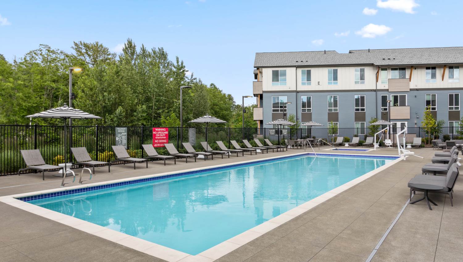 Swimming pool and lounge chairs at 207 East in Edgewood, Washington