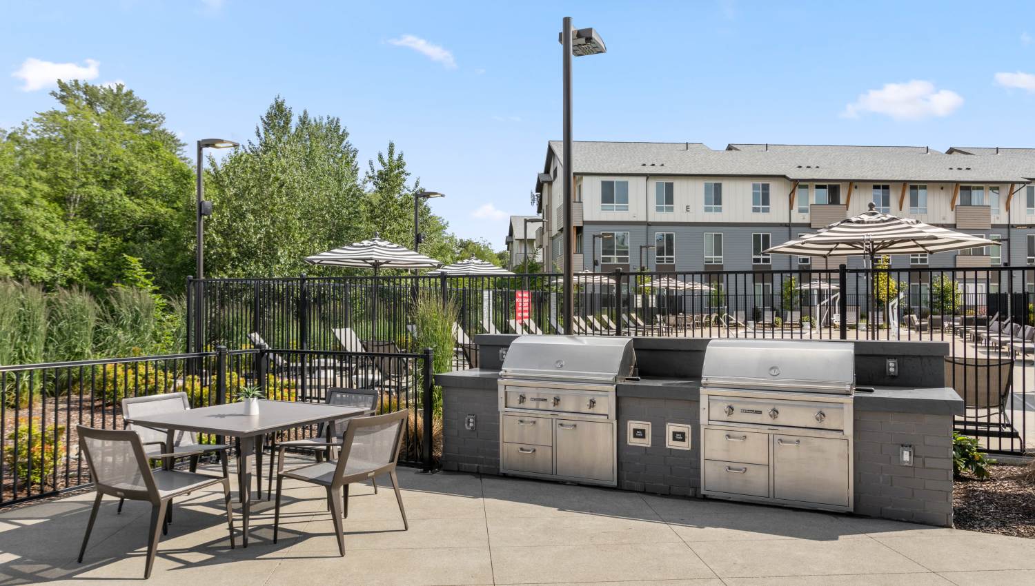 Grilling stations and picnic tables at 207 East in Edgewood, Washington