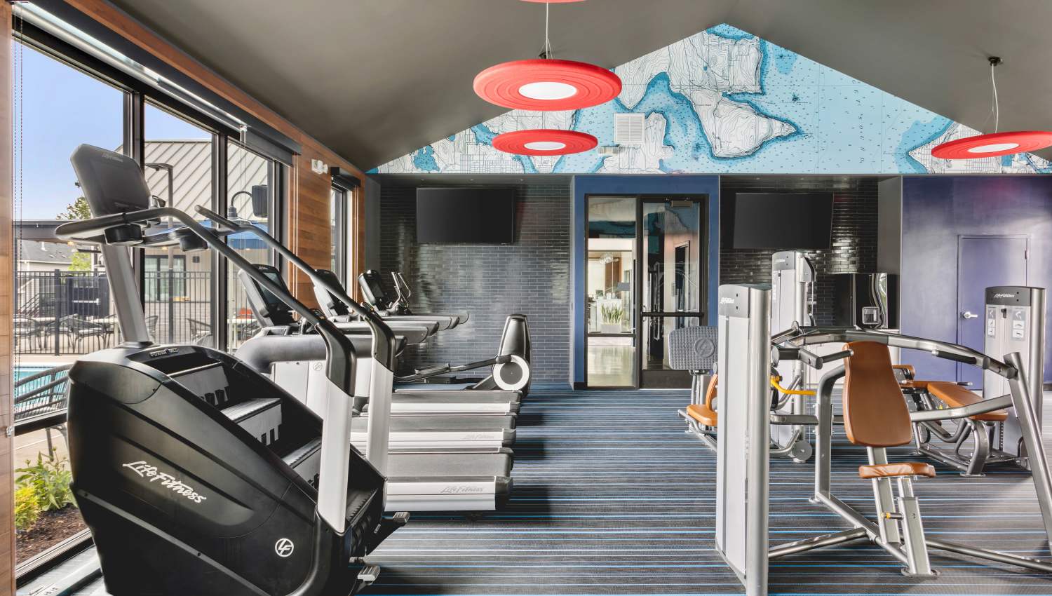 On-site gym with treadmills and other machines at Helm in Everett, Washington