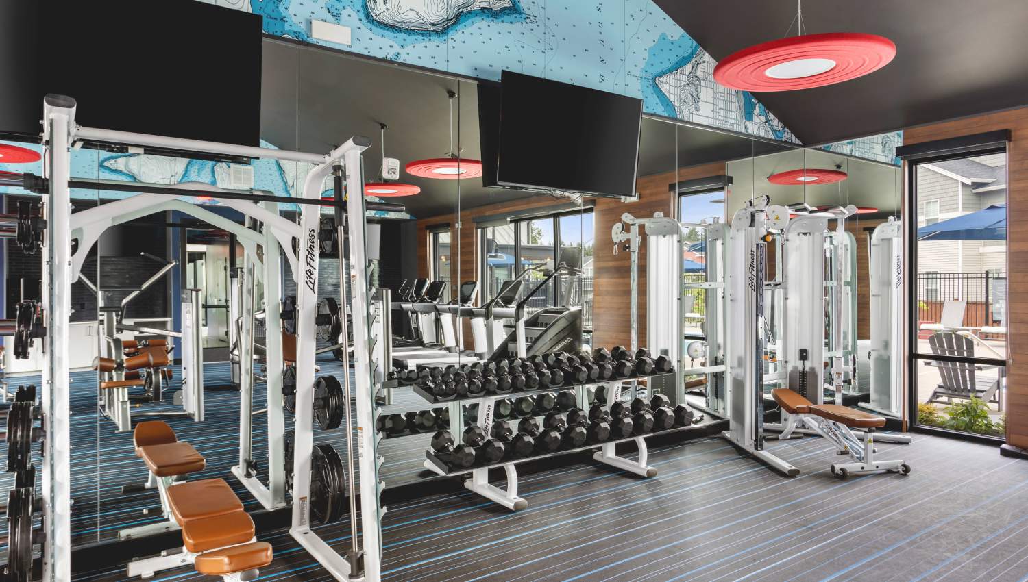 Fitness center with rack of weights at Helm in Everett, Washington