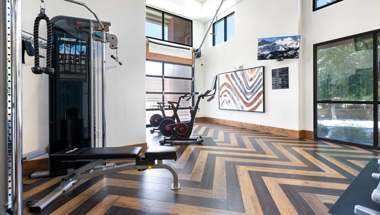 A gym with exercise equipment at Olympus Highlands North in Albuquerque, New Mexico