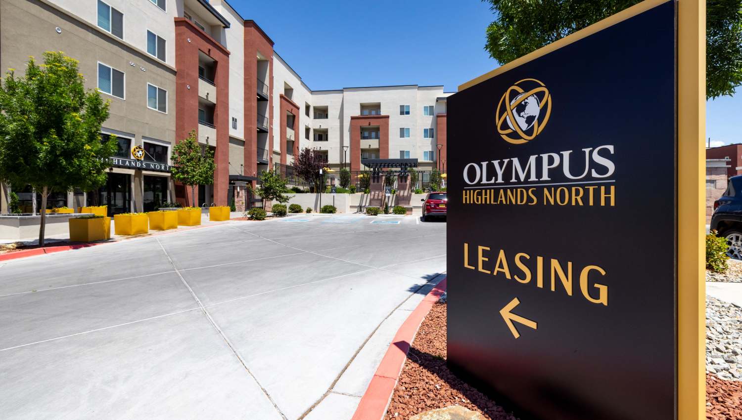 Property signage in front of a building at Olympus Highlands North in Albuquerque, New Mexico