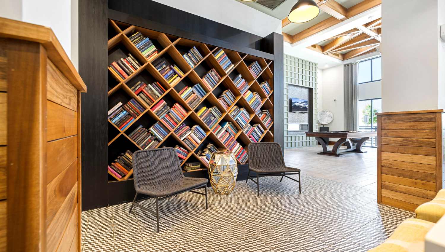 Clubhouse with book shelf at Olympus Highlands North in Albuquerque, New Mexico