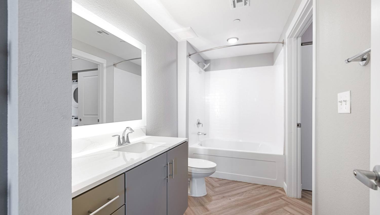 A bathroom with a sink and a toilet at Olympus Alameda in Albuquerque, New Mexico