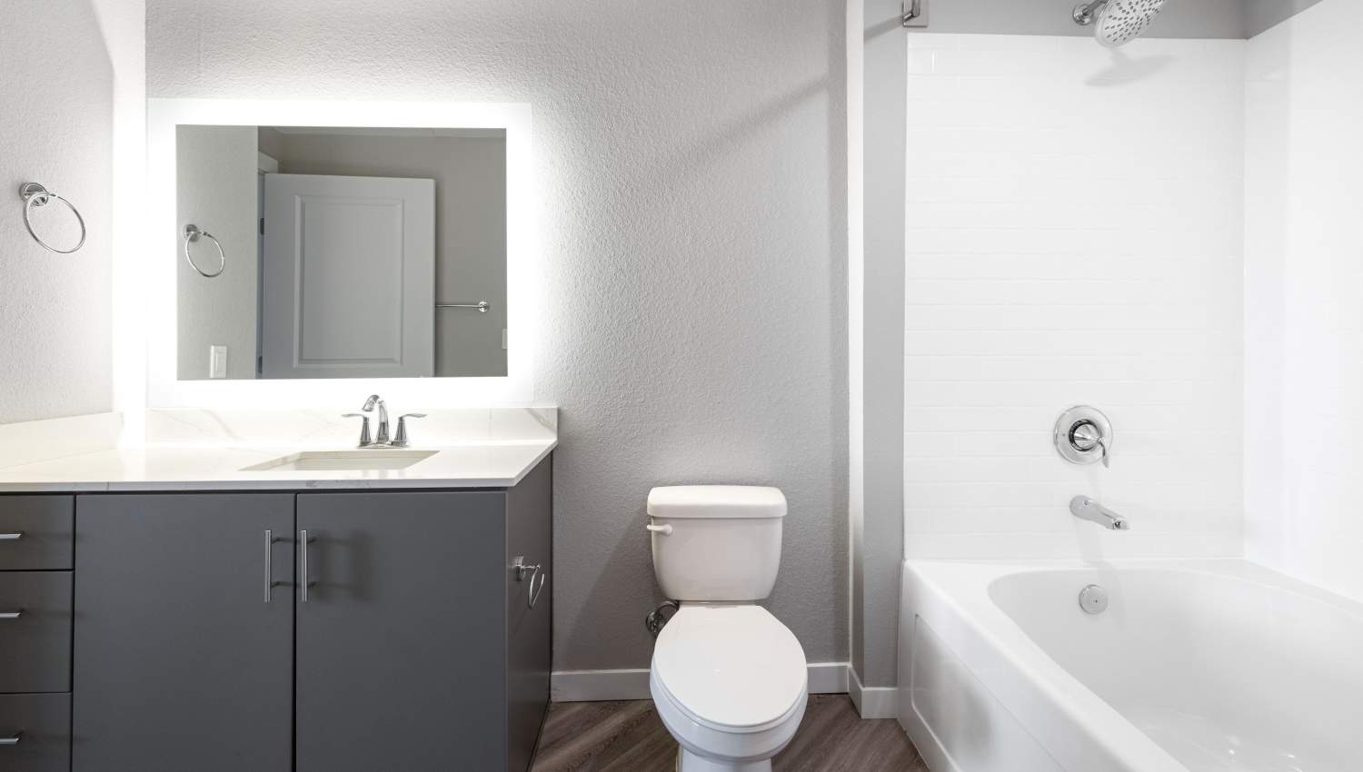 A bathroom with a sink and toilet at Olympus Alameda in Albuquerque, New Mexico