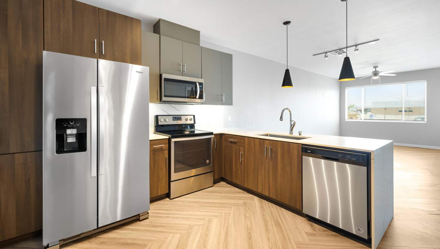 A kitchen with stainless steel appliances at Olympus Alameda in Albuquerque, New Mexico